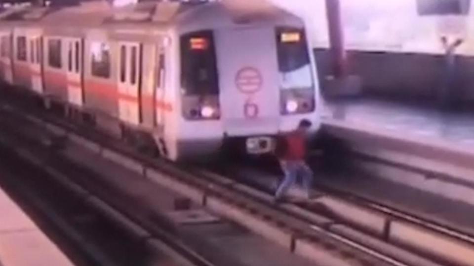 CCTV shows moment passenger walks across tracks in front of moving train on Delhi metro