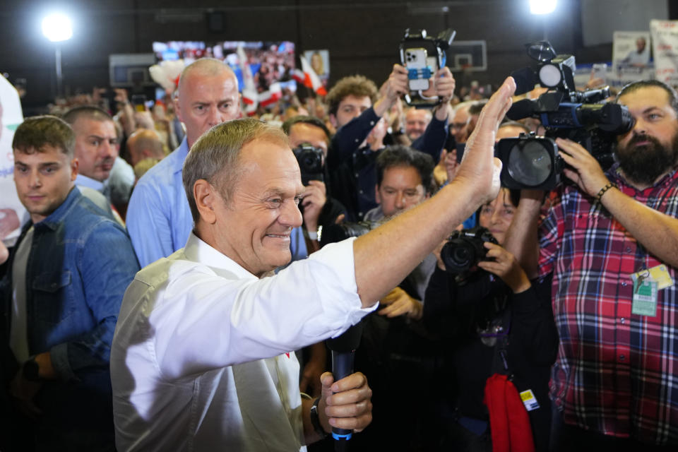 Poland's main opposition leader Donald Tusk arrives to address supporters during an election rally in Pruszkow, Poland, Friday, Oct. 13, 2023. Voters in Poland are heading into a divisive election Sunday, Oct. 15, 2023, that will chart the way forward for the European Union's fifth largest country by population size and its sixth biggest economy. Centrist coalition dominated by the Civic Platform party led by Donald Tusk, 66, a former Polish prime minister and former EU president, is the main opposition party. (AP Photo/Petr David Josek)