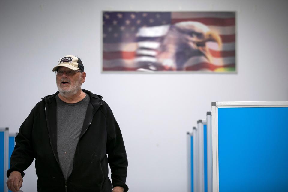 Steve Templin, of Lancaster, walks out after casting his vote in the Ohio election inside of the AMVETS Post 1985 on November 8, 2023, in Lancaster, Ohio,