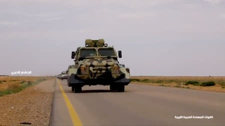 A military vehicle drives on a road in Libya, April 4, 2019, in this still image taken from video. Reuters TV via REUTERS