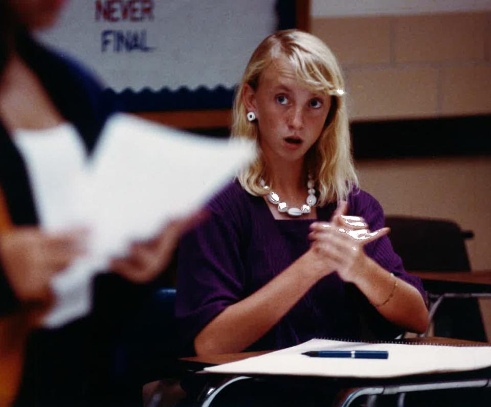 Keri Mays, 16-year-old Ray High School junior, signs questions during a debate contest at Carroll High School Sept. 17, 1992. The student competes with the aid of a CCISD employee, Lesa Thomas, who interprets Mays' signs for the judge.