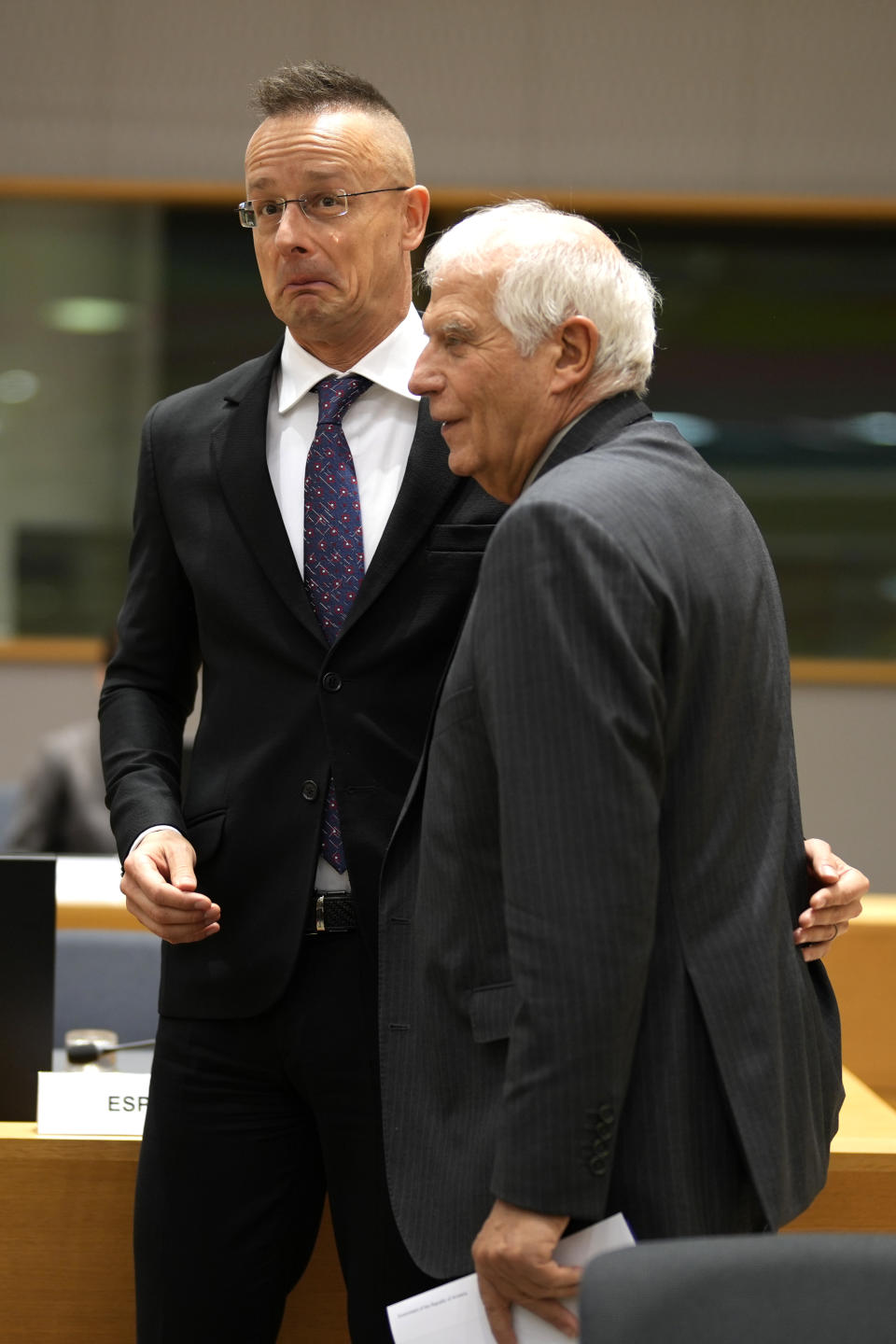 Hungary's Foreign Minister Peter Szijjarto, left, speaks with European Union foreign policy chief Josep Borrell during a meeting of EU foreign ministers at the European Council building in Brussels, Monday, Dec. 11, 2023. Pressure mounted on Hungary on Monday not to veto the opening of European Union membership talks and the supply of economic aid to war-torn Ukraine at a pivotal EU summit this week, after Prime Minister Viktor Orban demanded that the issue be struck from the agenda. (AP Photo/Virginia Mayo)