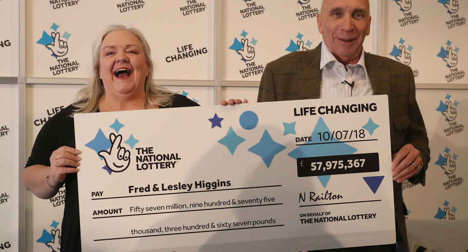 Retired couple Fred, 67, and Lesley Higgins, 57, celebrate their <span>£57.9m win</span>. Source: PA Wire via AAP