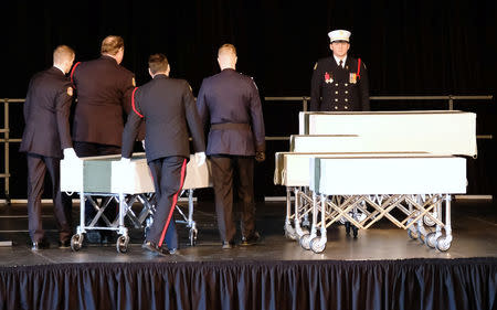 Halifax Regional Police and Fire Honour Guard move one of the caskets of the Barho family children during a funeral service for the Syrian refugee family who lost seven children in a February 19 house fire in Halifax, Nova Scotia, Canada February 23, 2019. REUTERS/Ted Pritchard