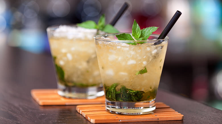 Two mint juleps on bar counter