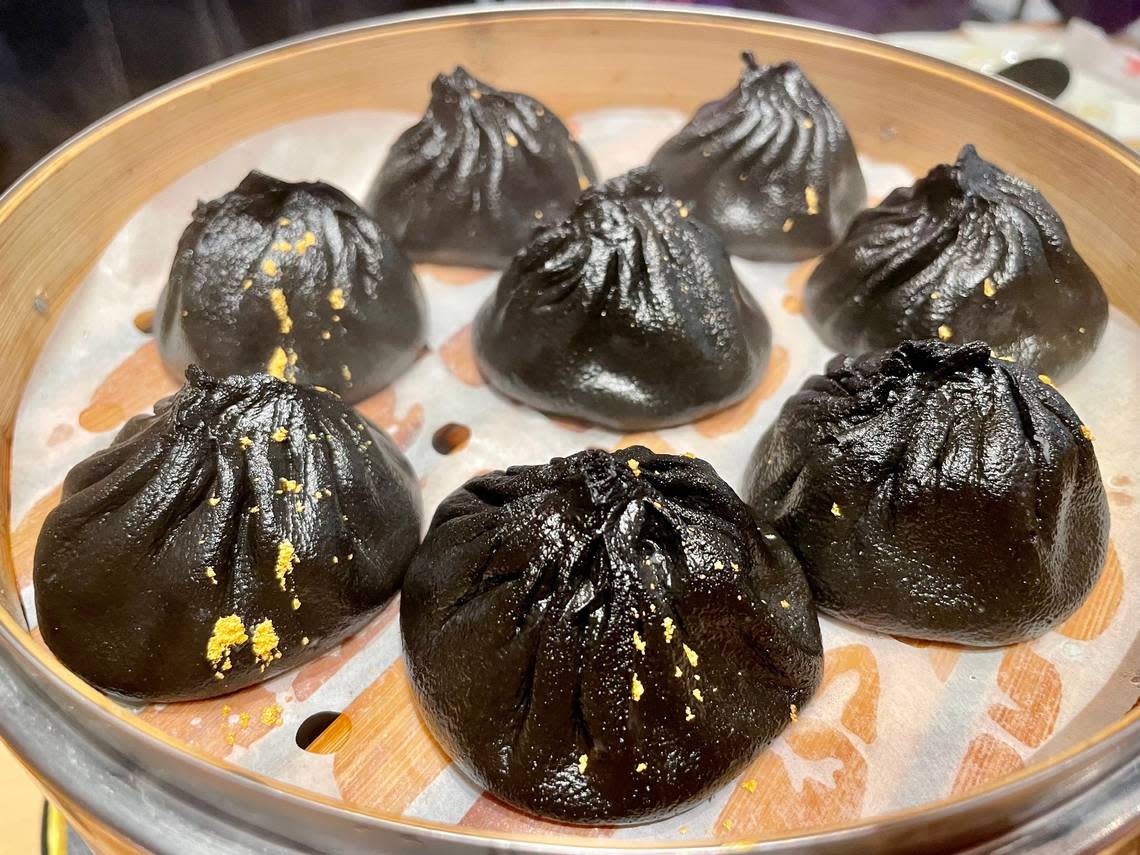 Uncle Dumpling’s truffle Berkshire xiaolongbao are tucked in dough dyed black by squid ink and sprinkled with edible gold.