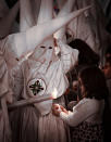 March 20: 'Ash Wednesday' by Javier Martinez de la Ossa. Ash Wednesday is one of the most celebrated festivals in Seville, Spain. During Holy Week - the seven days before Lent - there are processions and floats featuring sculptures depicting the events of Jesus's crucifixion. In these processions a number of people march wearing a long white gown and a distinctive pointed hood. They hold wax candles and march in silence.