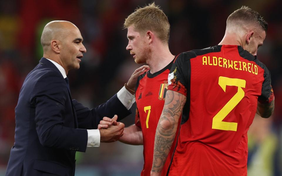 Kevin de Bruyne of Belgium (C) reacts with headcoach Roberto Martinez - Tolga Bozoglu/SHUTTERSTOCK