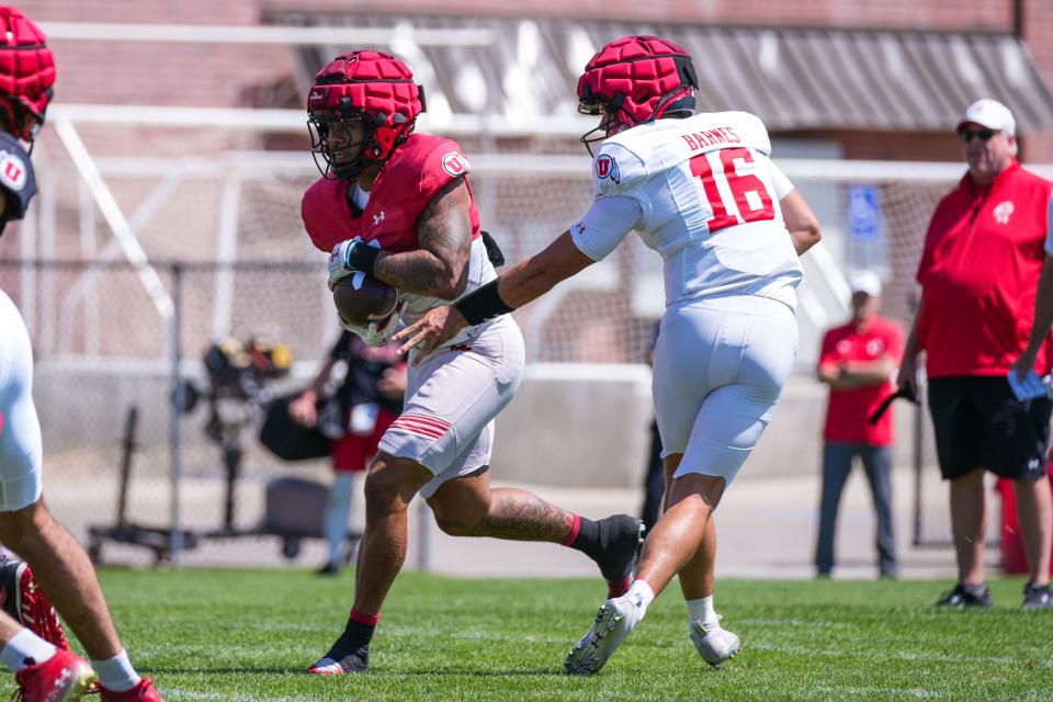 Bryson Barnes hands the ball off during Utah fall practice at Spence and Cleone Eccles Football Center in Salt Lake City, UT on Tuesday, August 8, 2023. | Eli Rehmer/Utah Athletics