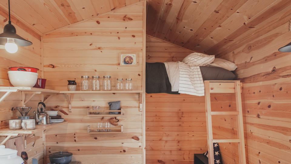 This photo provided by Settled and the Mosaic Christian Community shows the interior of one of the tiny homes planned for people coming out of chronic homelessness in St. Paul, Minn., in the fall of 2021. (John Swee/Dodge Creative Photography/Settled/Mosaic Christian Community via AP)