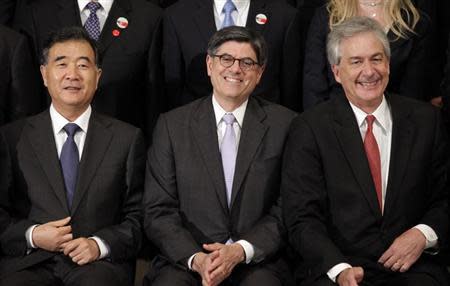 Chinese Vice Premier Wang Yang (L-R), U.S. Treasury Secretary Jack Lew and Deputy Secretary of State Bill Burns participate in the family photo during the U.S.-China Strategic and Economic Dialogue (S&ED) at the State Department in Washington July 10, 2013. REUTERS/Yuri Gripas