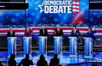 Candidates try to speak near the conclusion of the ninth Democratic 2020 U.S. presidential debate at the Paris Theater in Las Vegas, Nevada, U.S.,
