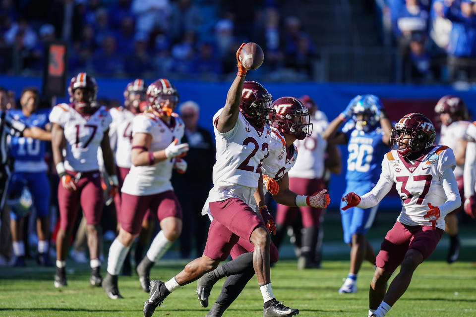 Dec 31, 2019; Charlotte, North Carolina, USA; Virginia Tech Hokies defensive back Chamarri Conner (22) celebrates his fumble recovery during the second half against the Kentucky Wildcats at the Belk Bowl at Bank of America Stadium. Mandatory Credit: Jim Dedmon-USA TODAY Sports