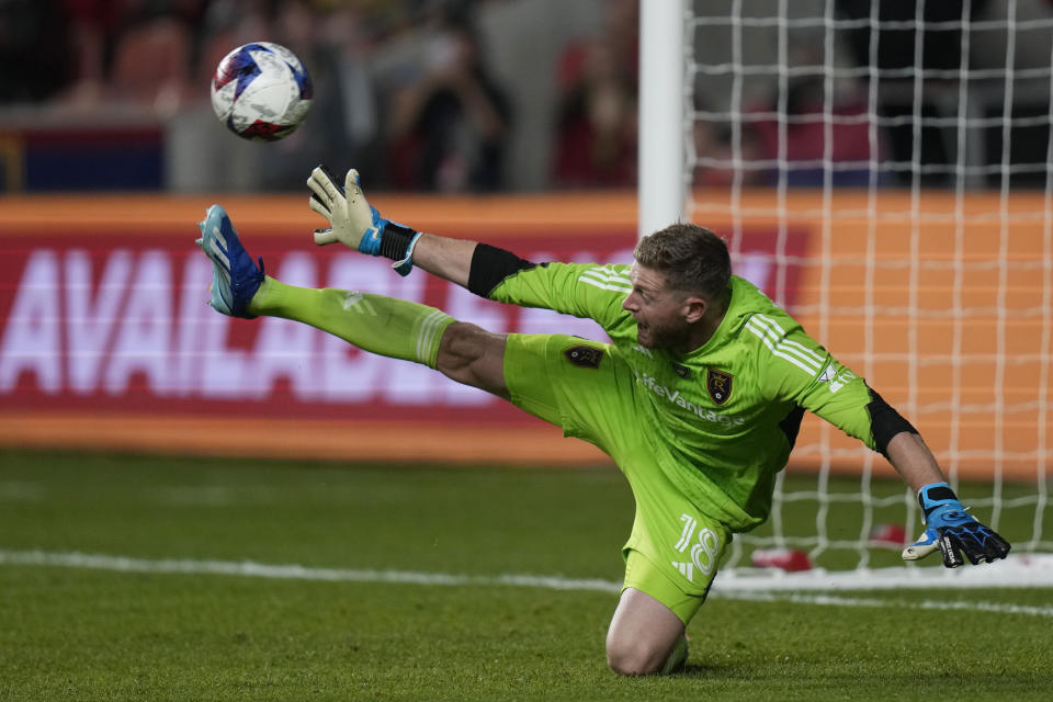 Real Salt Lake goalkeeper Zac MacMath reaches for the ball on a goal by Sporting Kansas City forward Alán Pulido during the second half of an MLS soccer match Saturday, Oct. 7, 2023, in Sandy, Utah. (AP Photo/Rick Bowmer)