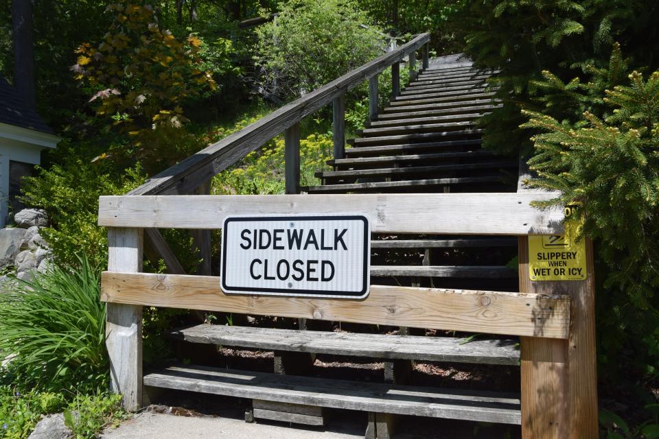 The entrance to the bluff boardwalk by 3rd Street showing a closed sign on Friday, May 26, 2023. Construction on the western half of the boardwalk is on track to be completed by July 4.
