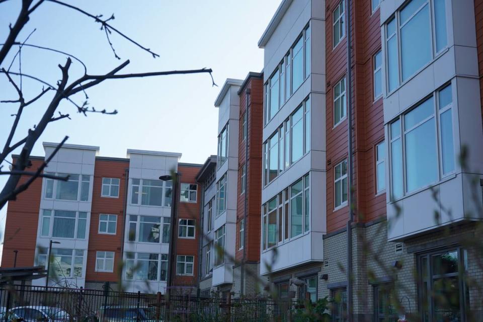 The sun sets behind the Eleanor Apartments on Tuesday, April 11, 2023, at 1510 N. Forest St. in Bellingham, Wash. The affordable housing complex is designed to house tenants who make 30% and 50% of the area’s median income.