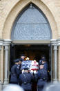 Capitol Police Officers carry the casket of their fellow officer, the late William "Billy" Evans into St. Stanislaus Kotska Church in Adams, Mass., for his funeral on Thursday, April 15, 2021. Evans was killed this month when a driver struck him and another officer at a barricade outside the Senate. (Stephanie Zollshan/The Berkshire Eagle via AP)