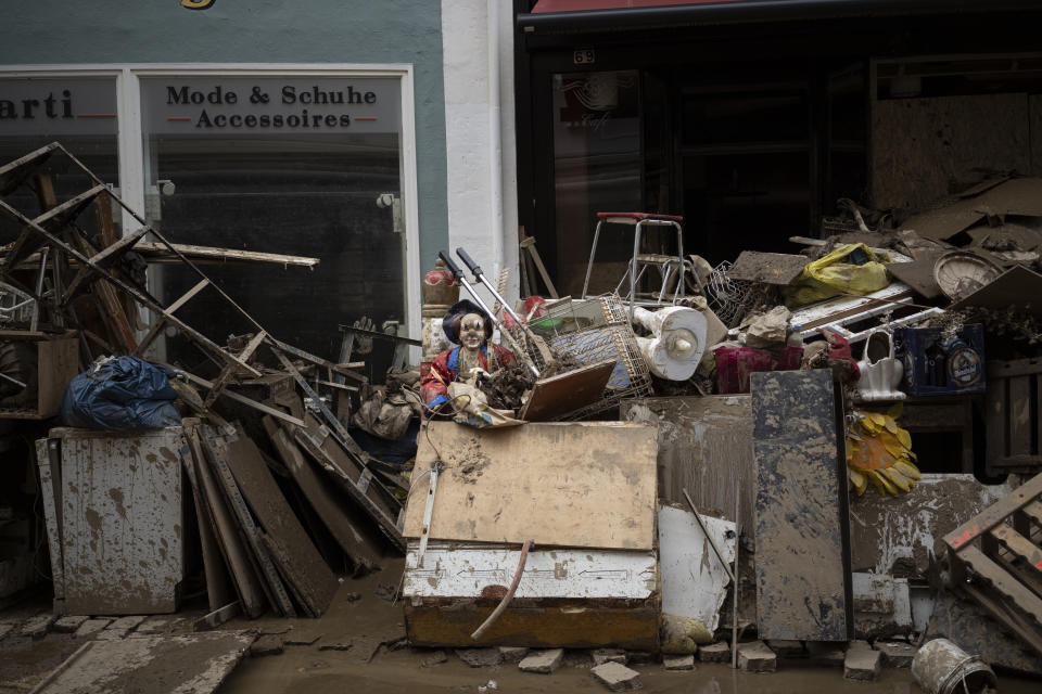 A pile of rubbish is seen in the town Bad Neuenahr-Ahrweiler, Germany, Monday July 19, 2021. More than 180 people died when heavy rainfall turned tiny streams into raging torrents across parts of western Germany and Belgium, and officials put the death toll in Ahrweiler county alone at 110. (AP Photo/Bram Janssen)