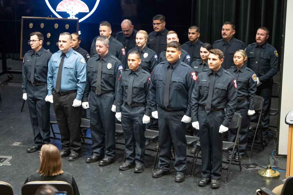 Graduates of the Pueblo Community College Law Enforcement Academy stand at attention during their commencement ceremony at the Hoag Theater on Friday, May 10, 2024.