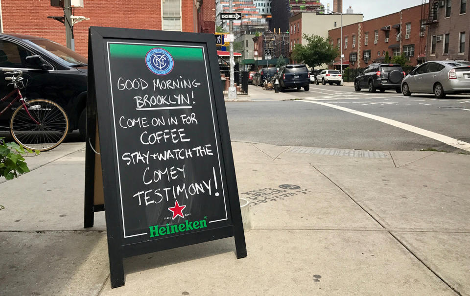 <p>A sign welcomes people into South 4th Bar to watch former FBI director James Comey testify before the Senate Intelligence committee in Brooklyn, New York, June 8, 2017. (Yahaira Jacquez/Reuters) </p>