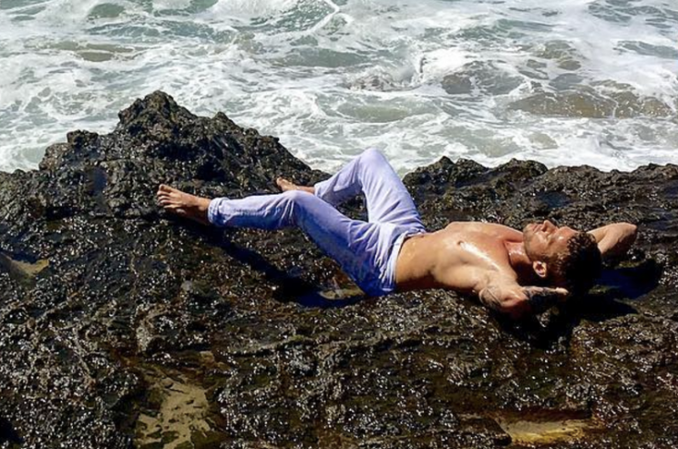 Ryan Phillippe wore wet white jeans — and lots of baby oil — for a seaside photo shoot with a fitness mag