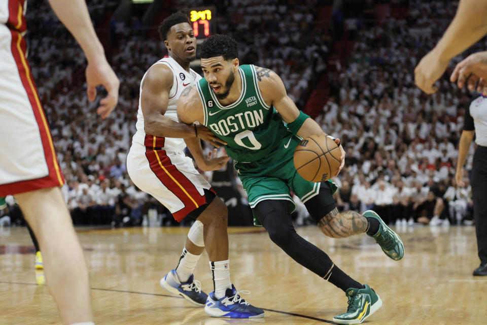 May 23, 2023; Miami, Florida, USA; Boston Celtics forward Jayson Tatum (0) shoots against Miami Heat guard Kyle Lowry (7) in the third quarter during game four of the Eastern Conference Finals for the 2023 NBA playoffs at Kaseya Center. Mandatory Credit: Sam Navarro-USA TODAY Sports