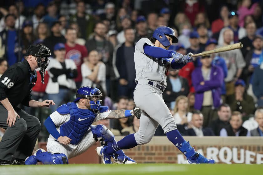 Los Angeles Dodgers' James Outman watches his grand slam against the Chicago Cubs during the ninth inning of a baseball game in Chicago, Thursday, April 20, 2023. (AP Photo/Nam Y. Huh)