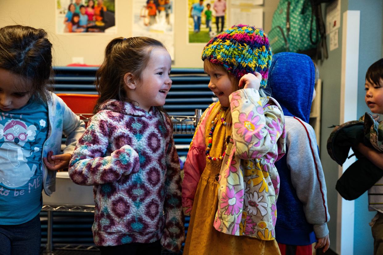 Julliette McKenrick and Goldie Vleck line up to play outside at Teaching Tree Early Childhood Learning Center in Fort Collins on Oct. 16.