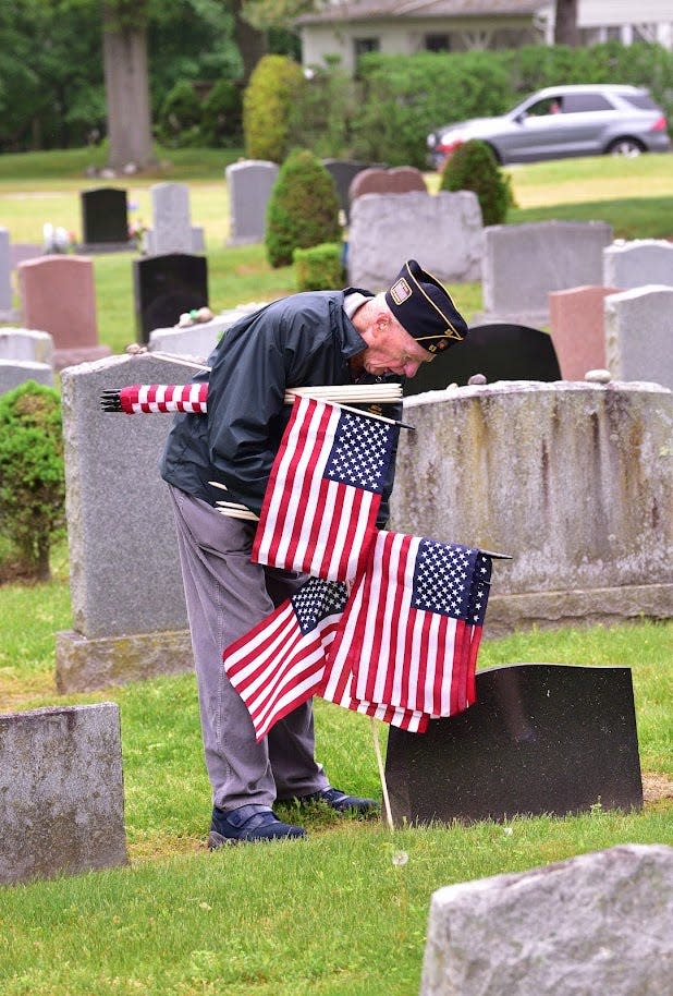 Members of Ridgewood's American Legion Post 53 went to Valleau Cemetery to place American flags on the graves of the veterans buried there.