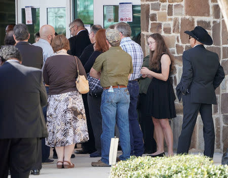 Mourners gather for a funeral for six members of the Holcombe family and three members of the Hill family, victims of the Sutherland Springs Baptist church shooting, in Floresville, Texas, U.S., November 15, 2017. REUTERS/Darren Abate