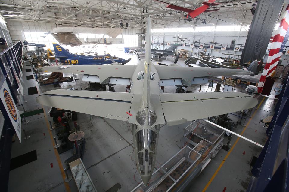 A second-floor view of U.S. military aircraft inside the main hangar at the MAPS Air Museum.