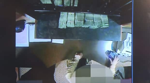 Surveillance footage of alleged money laundering. Attorney General David Eby said the tape shows wads of $20 bills being exchanged in a casino cash cage.