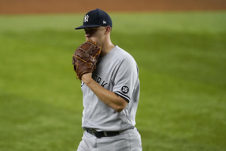 New York Yankees starting pitcher Jameson Taillon walks to the dugout after working against the Texas Rangers in the third inning of a baseball game in Arlington, Texas, Tuesday, May 18, 2021. (AP Photo/Tony Gutierrez)