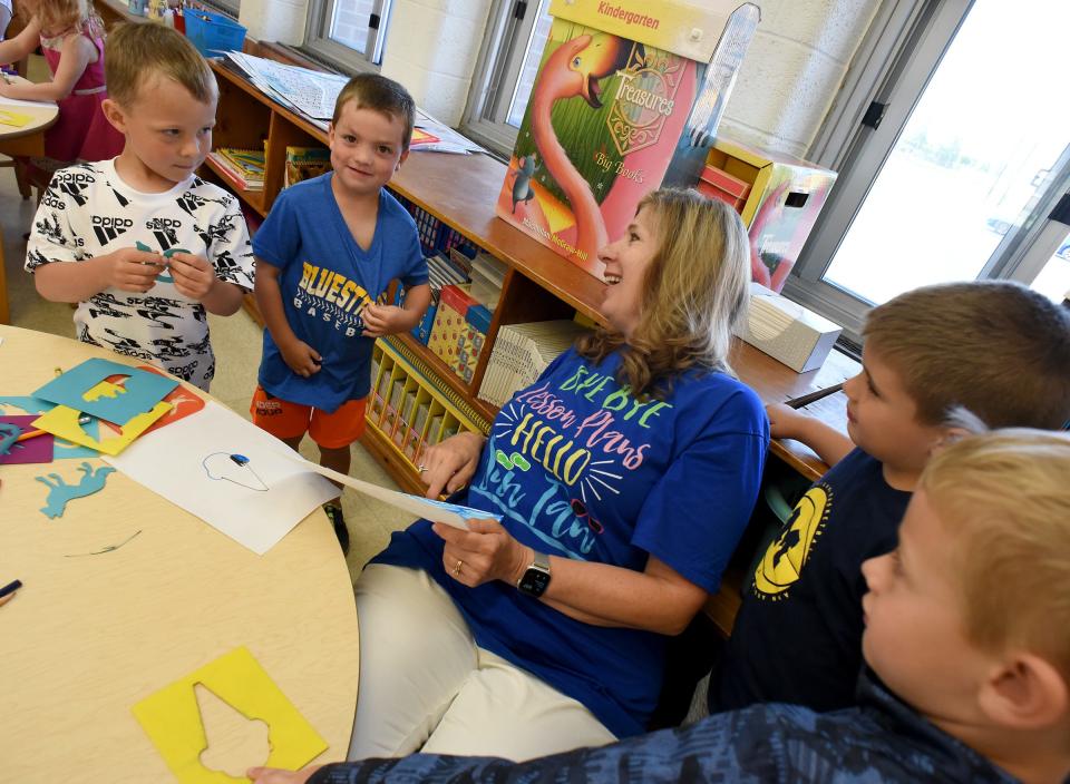 Ida Elementary kindergarten teacher Sherry Locke enjoys her time with the young five students on the last day of school.