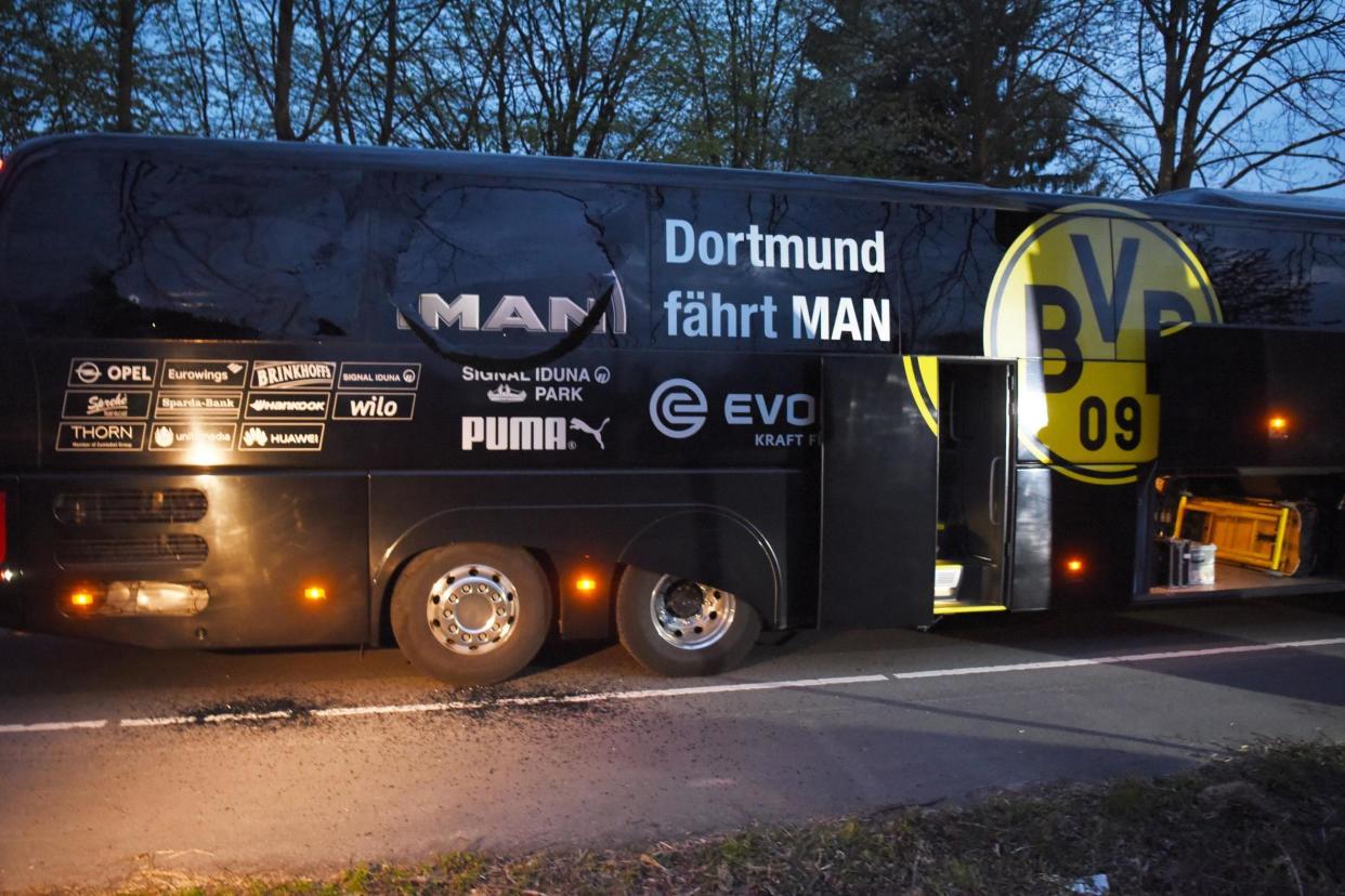 Dortmund defender Marc Bar tra, 26, and a police officer were injured: AFP/Getty Images