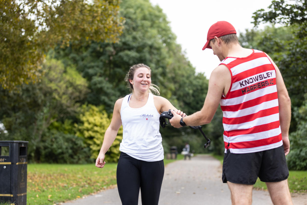 Jazmine Franks (left) passed on a GPS tracker to the next runner after completing the first leg of the artwork (Phil Tragen/ John Doe)