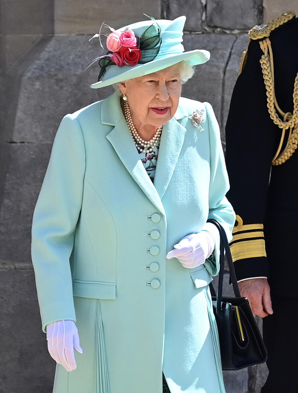 WINDSOR, UNITED KINGDOM - JULY 17: (EMBARGOED FOR PUBLICATION IN UK NEWSPAPERS UNTIL 24 HOURS AFTER CREATE DATE AND TIME) Queen Elizabeth II arrives to present Captain Sir Thomas Moore with the insignia of Knight Bachelor during an investiture ceremony at Windsor Castle on July 17, 2020 in Windsor, England. British World War II veteran Captain Tom Moore raised over £32 million for the NHS during the coronavirus pandemic. (Photo by Pool/Max Mumby/Getty Images)