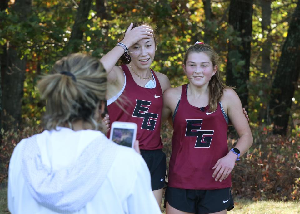 East Greenwich runners Reese Fahys, left,  and Rylee Shunney after an October meet.