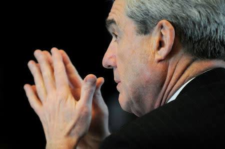 FILE PHOTO: Robert Mueller, serving as U.S. FBI director, attends a meeting of Cabinet-level officials to discuss efforts against human trafficking at the State Department in Washington, February 1, 2011. REUTERS/Jonathan Ernst/File Photo