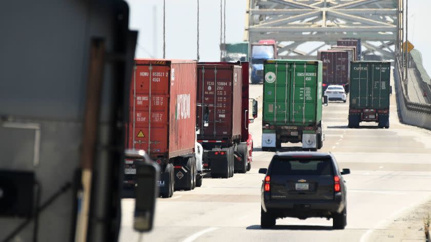 LOS ANGELES, CALIFORNIA JULY 19, 2017-Trucks make there way up the Gerald Desmond Bridge at the Port of Los Angeles Wednesday. The nation's largest port complex will seek up to $14 billion in public and private funds to slash air pollution and health risks to Southern Californians by replacing diesel trucks and cargo-handling equipment with zero-emmissions technology over the next two decades. (Wally Skalij/Los Angeles Times)