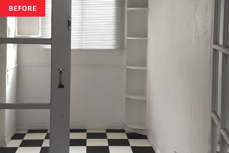 Black and white checkered tile floor, built in book case in corner, blinds on window, french doors with glass panels