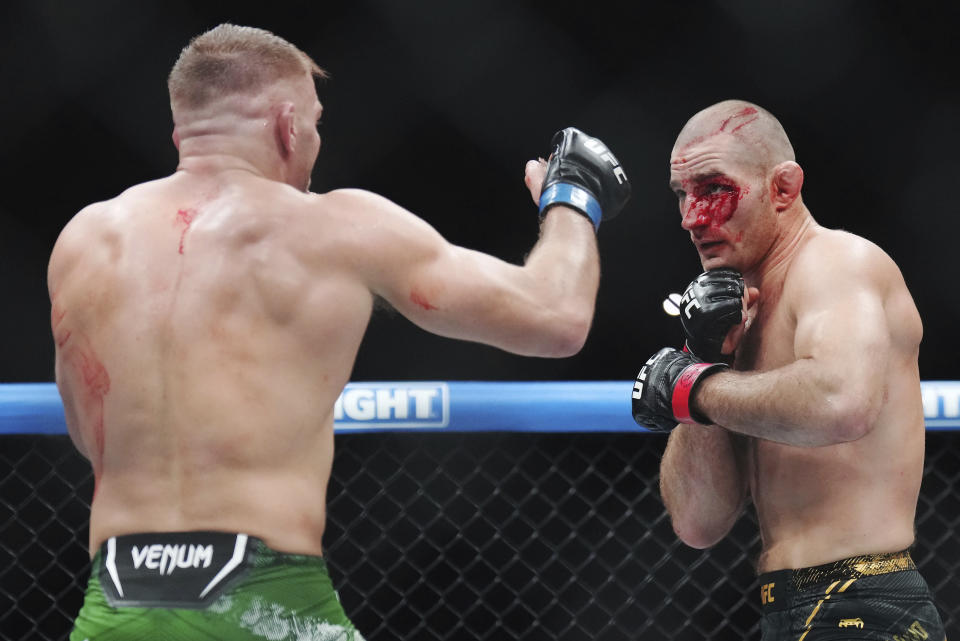 Sean Strickland, right, fights Dricus Du Plessis during a middleweight title bout during the UFC 297 mixed martial arts event in Toronto early Sunday, Jan. 21, 2024. (Nathan Denette/The Canadian Press via AP)