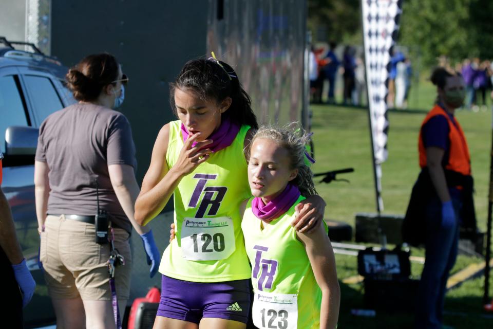 Two Rivers' Anna Gallagher (120) and Mikaela Helling (123) after their first and second finishes at the Kiel Cross Country Invitational Cross Country meet, Thursday, Sept. 3, 2020, in Kiel.