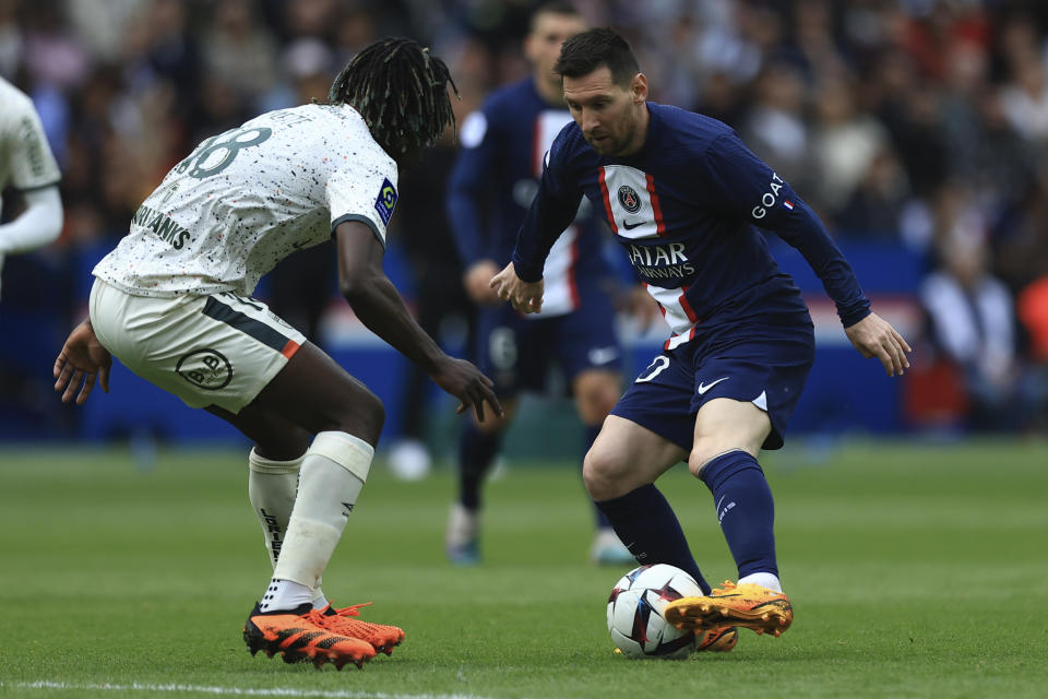 PSG's Lionel Messi, right, face Lorient's Bamo Meite during the French League One soccer match between Paris Saint-Germain and Lorient, at the Parc des Princes stadium in Paris, Sunday, April 30, 2023. (AP Photo/Aurelien Morissard)