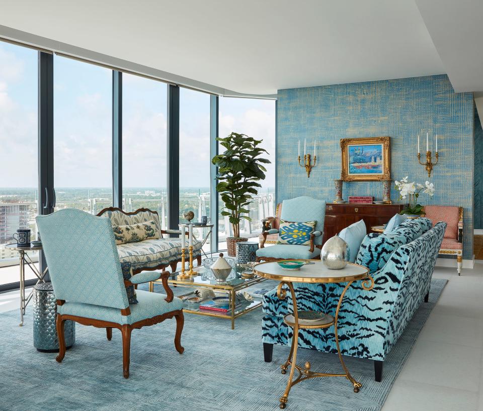 In the living area, homeowner Cindy Bardes Galvin, an interior designer, chose a color scheme focused on blue, which complements the colors of the sky and Atlantic outside the windows and glass doors.