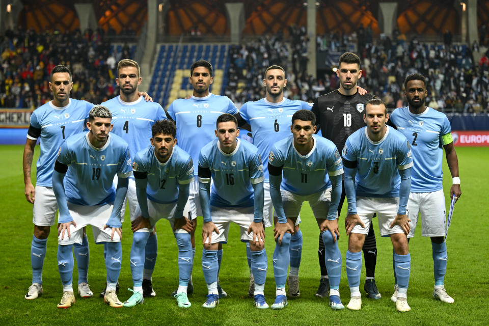 Israel players pose ahead of the Euro 2024 group I qualifying soccer match between Israel and Romania at the Pancho Arena in Felcsut, Hungary, Saturday, Nov. 18, 2023. (AP Photo/Denes Erdos)