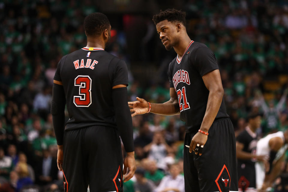 Jimmy Butler tries to talk to Dwyane Wade. (Getty Images)