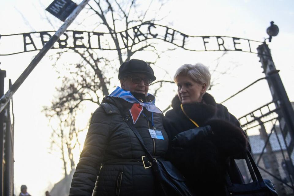 Survivors walking through the Auschwitz gates | Omar Marques/Getty