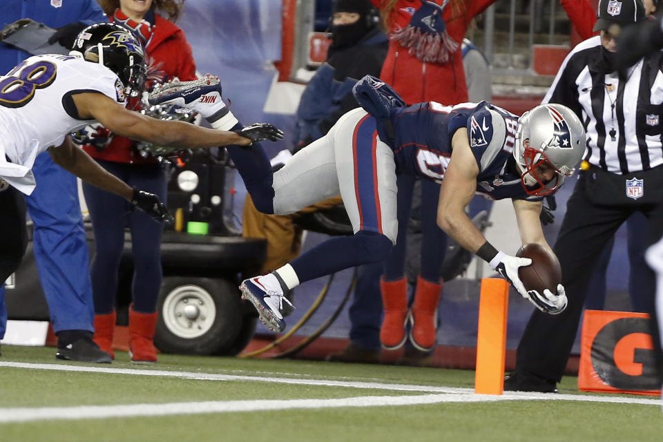 FILE - New England Patriots wide receiver Danny Amendola (80) dives into the end zone for a touchdown after catching a pass against the Baltimore Ravens in the first half of an NFL divisional playoff football game on Jan. 10, 2015, in Foxborough, Mass. Amendola, who earned two Super Bowl rings with the Patriots and became one of Tom Brady’s favorite playmakers during his five seasons in New England, is retiring. (AP Photo/Elise Amendola, File)