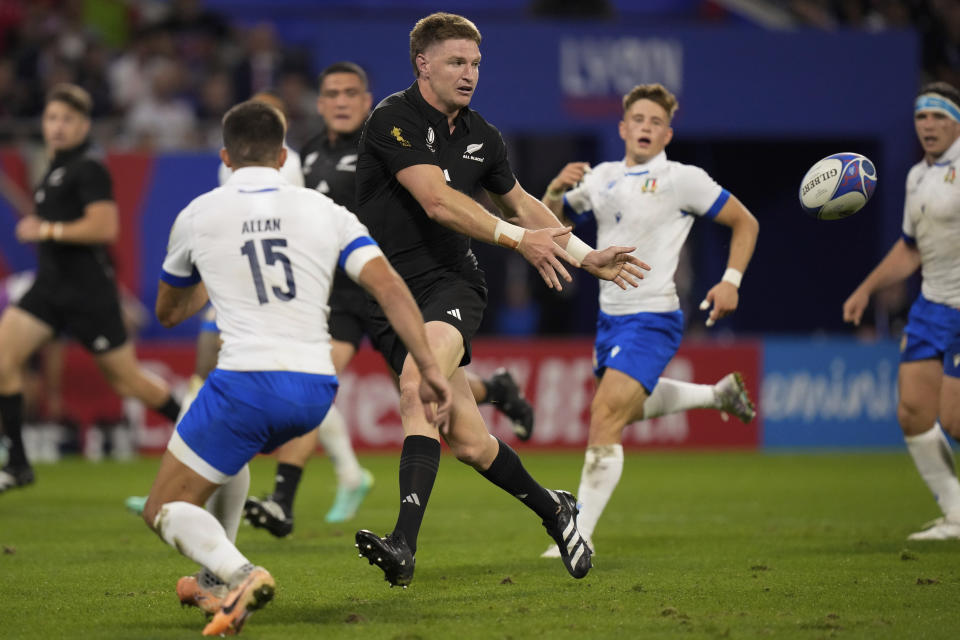 New Zealand's Jordie Barrett passes the ball during the Rugby World Cup Pool A match between New Zealand and Italy at the OL Stadium in Lyon, France, Friday, Sept. 29, 2023. (AP Photo/Pavel Golovkin)